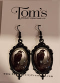Black Raven earrings in black frame