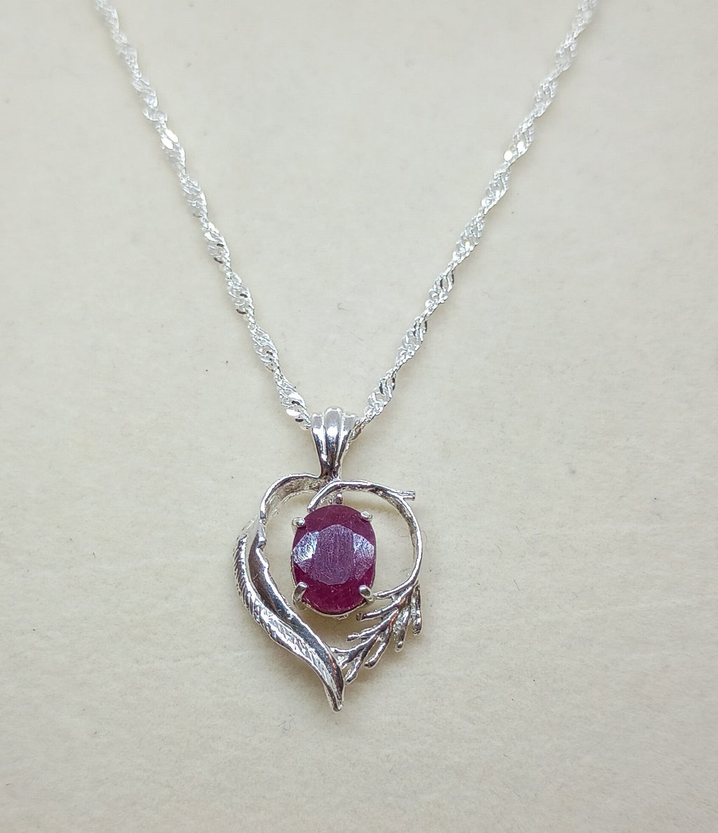 Ruby in heart & feathers setting